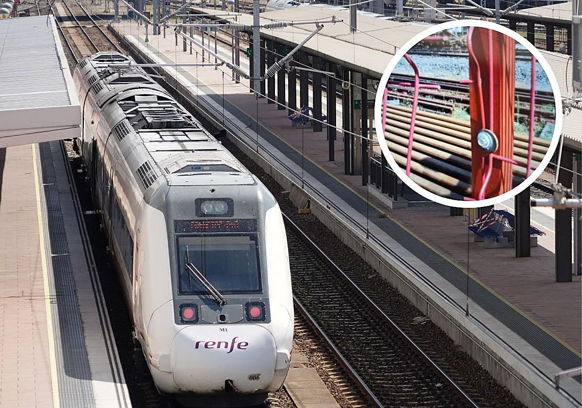 Un tren de renfe en la estación de Salamanca. En el círculo, la valla de acceso rota.