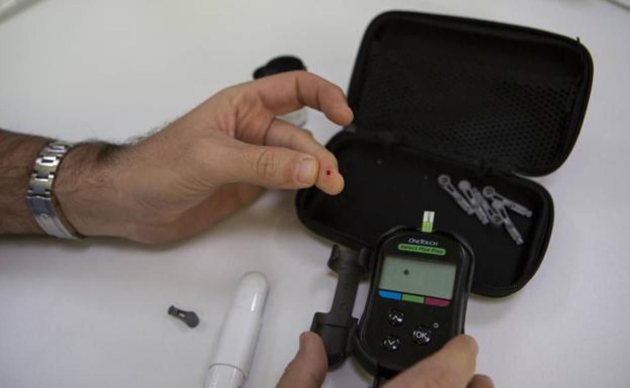 A diabetic checks his blood glucose level. 