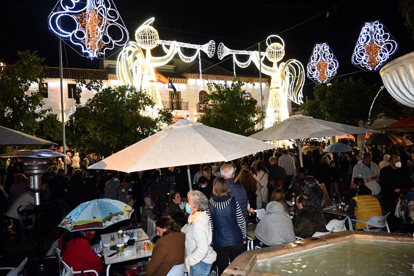 Crowds gathered at Marbella's Christmas lights despite the threat of rain.