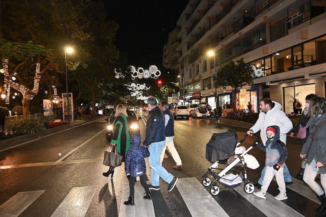 Crowds gathered at Marbella's Christmas lights despite the threat of rain.