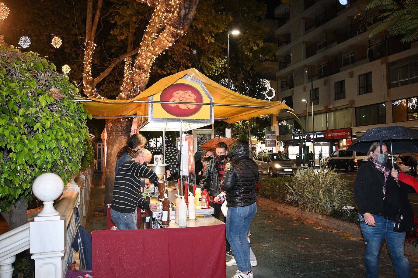 Crowds gathered at Marbella's Christmas lights despite the threat of rain.