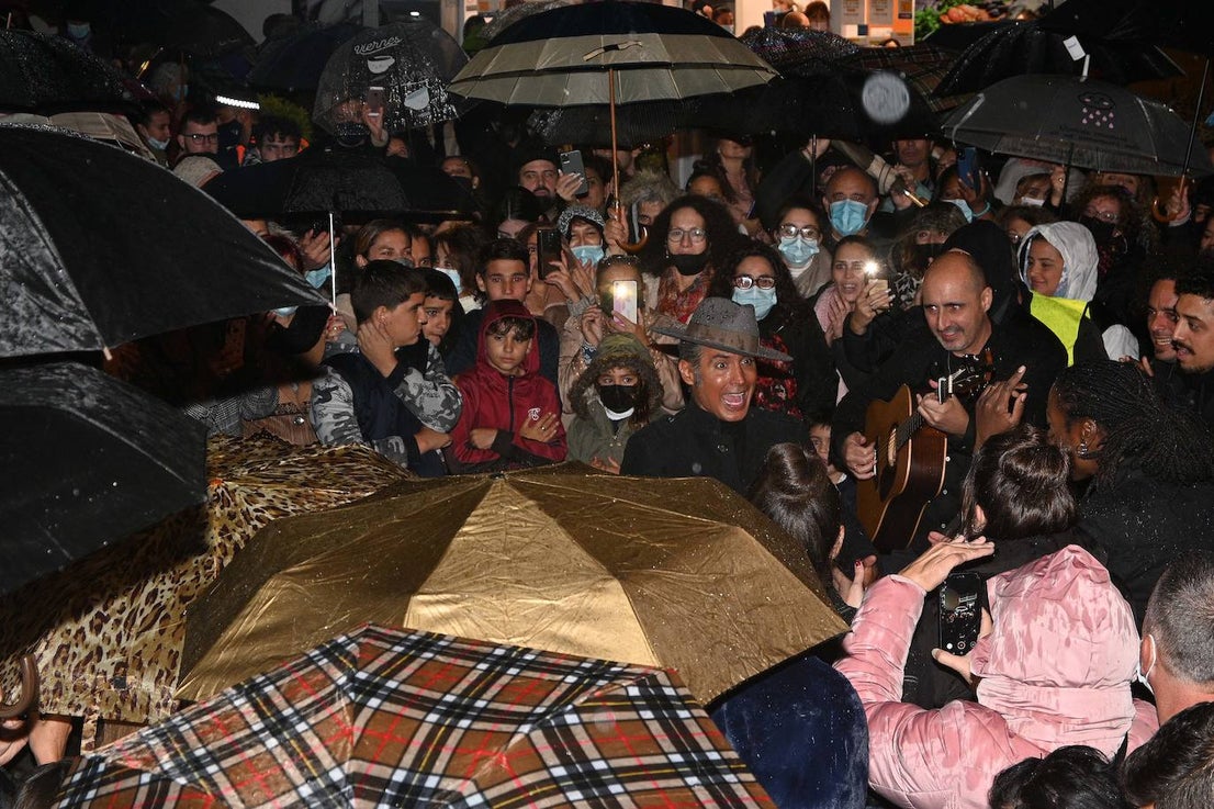 Crowds gathered at Marbella's Christmas lights despite the threat of rain.