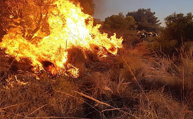 Firefighters tackle the flames on Sunday evening. 