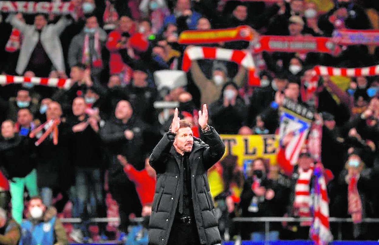 Diego Simeone celebrates Atletico Madrid's win against Valencia. 