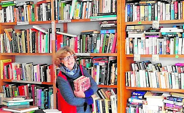 Louie Castle, who also lives in San Pablo, helps to run the book exchange every Saturday.