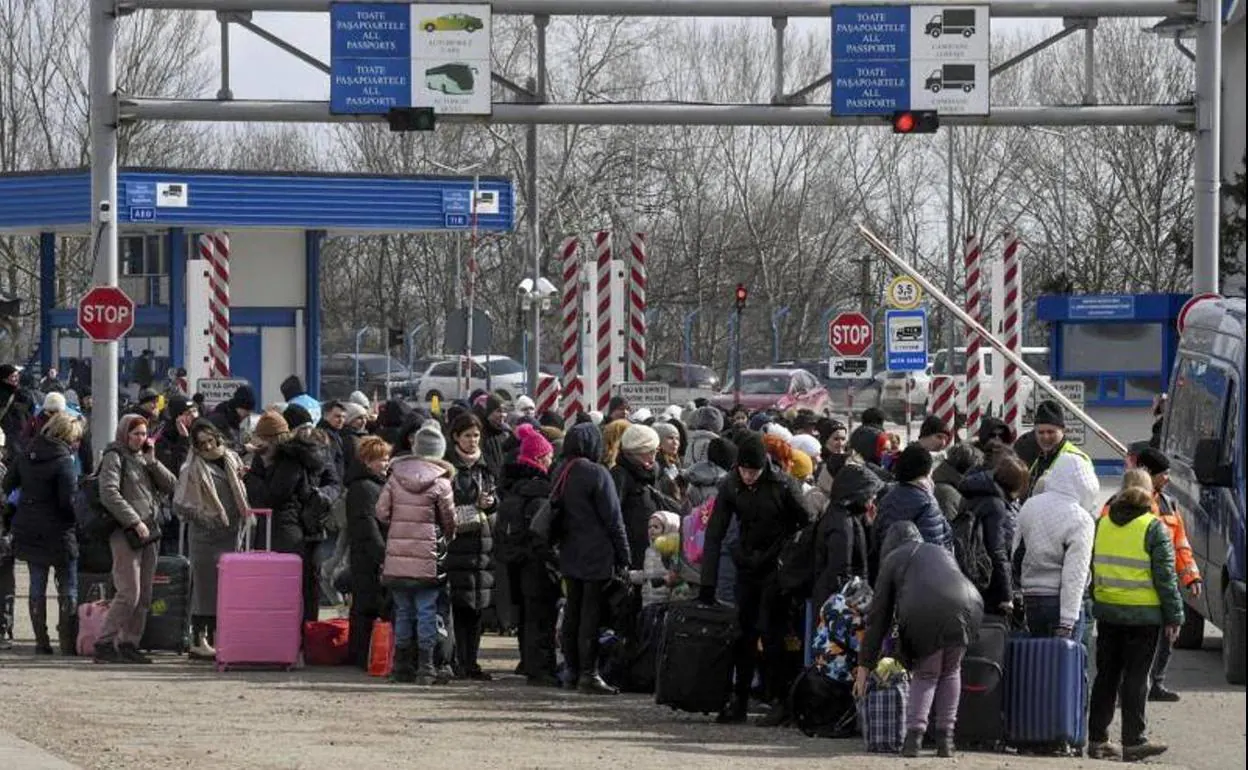 Refugees crossing the Ukraine border into Moldova.