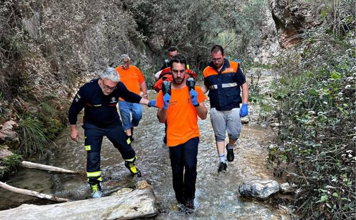 Fire fighters and Civil Protection officers carried the woman on a stretcher for about two kilometres 