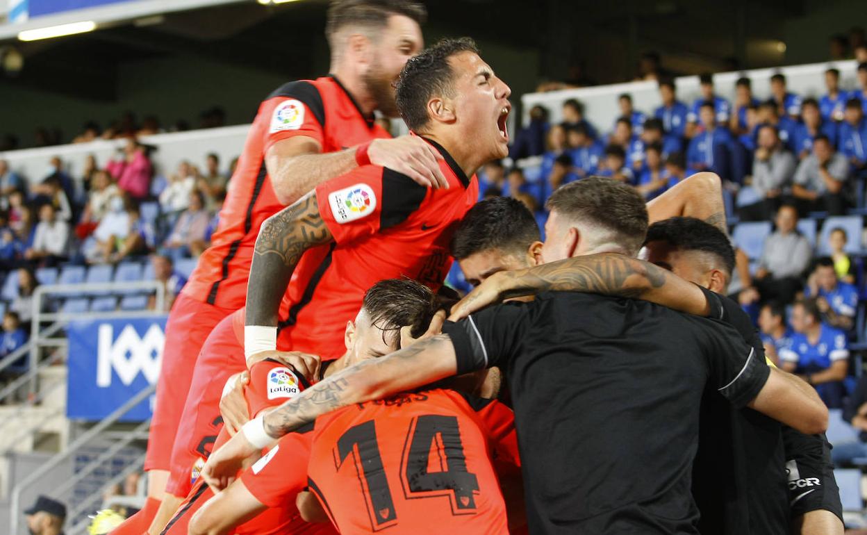 Malaga celebrate scoring the second goal against Tenerife. 