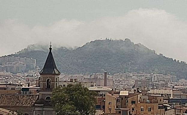Low clouds around the Gibralfaro castle were mistaken for smoke.