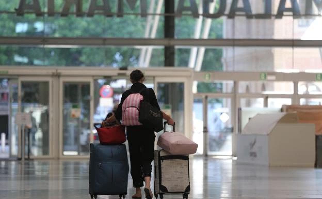 A tourist leaving Malaga's central train station. 