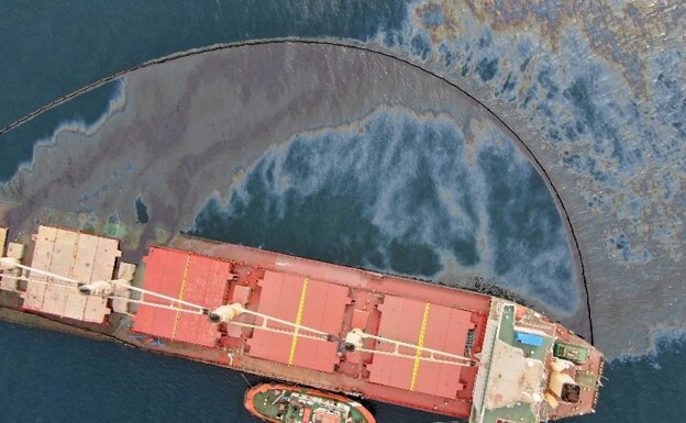 A clean-up operation is under way to collect the spillage of heavy fuel oil. 