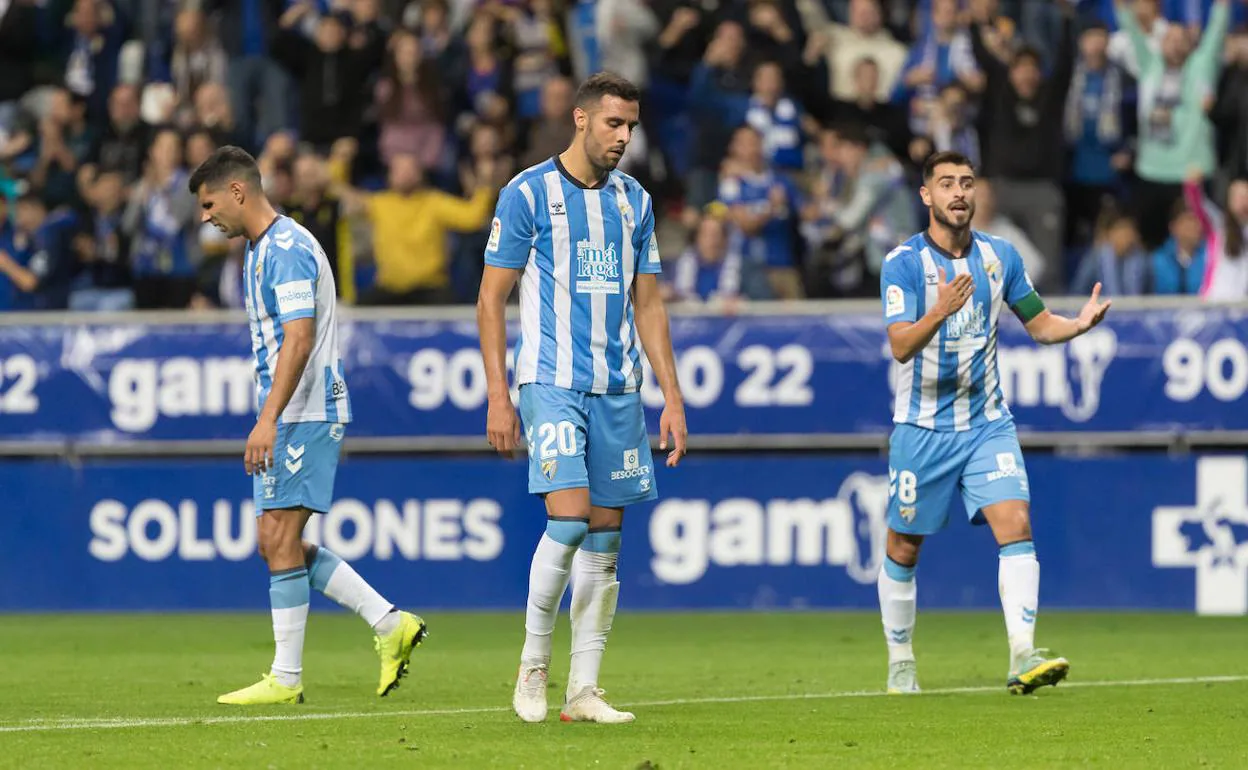 Dejected Malaga players during their game against Real Oviedo. 
