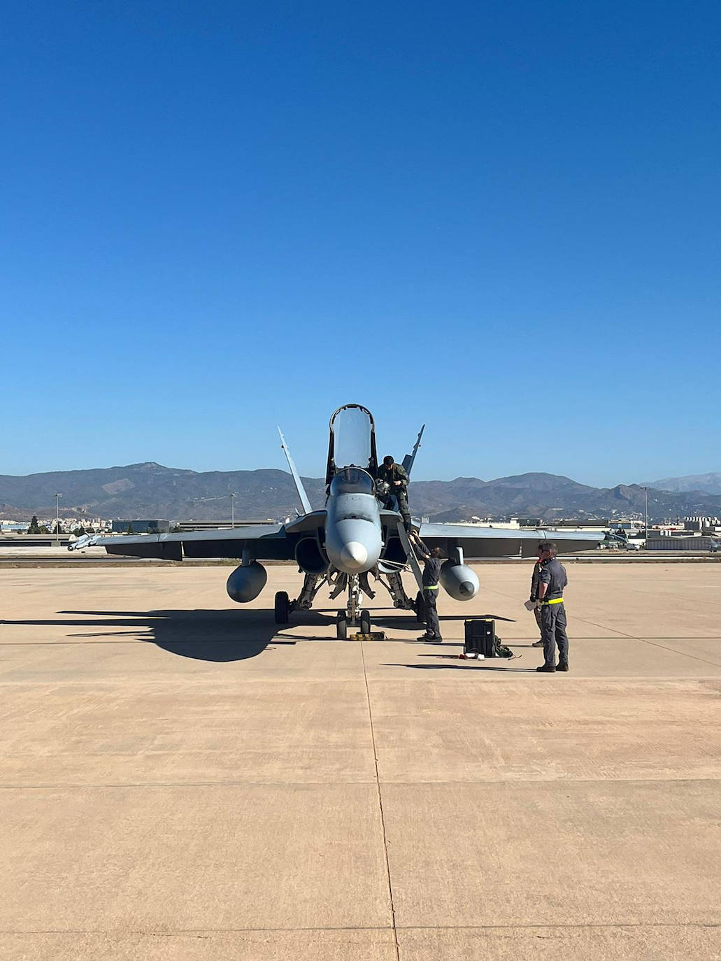 F-18 fighters fly over the surroundings of the airport and the Bay of Malaga . 