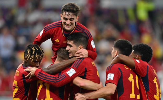 Spain players celebrate scoring their seventh goal in their 7-0 win over Costa Rica. 