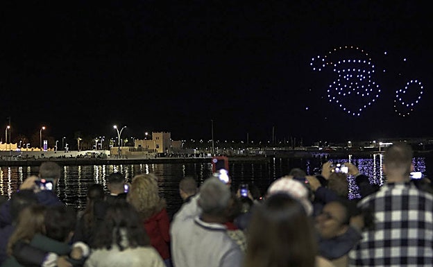 Spectators enjoy the drone show. 