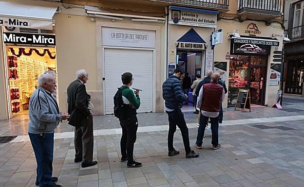 A queue outside a lottery ticket office in Malaga city. 