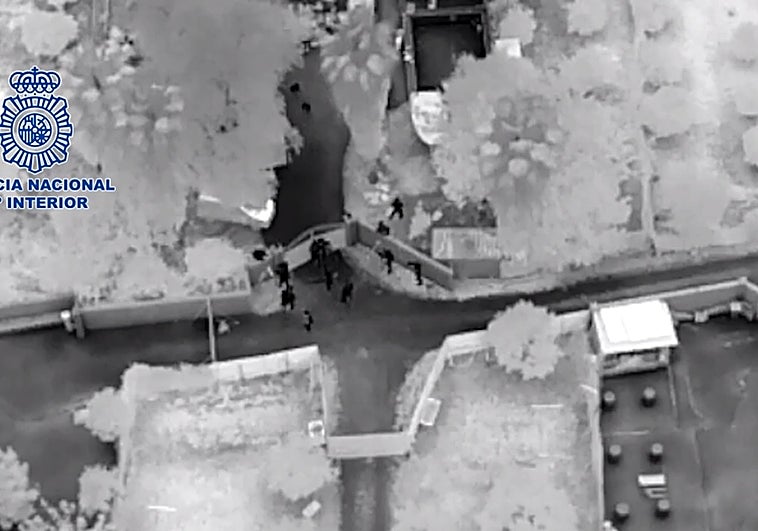 National Police officers enter the farm.