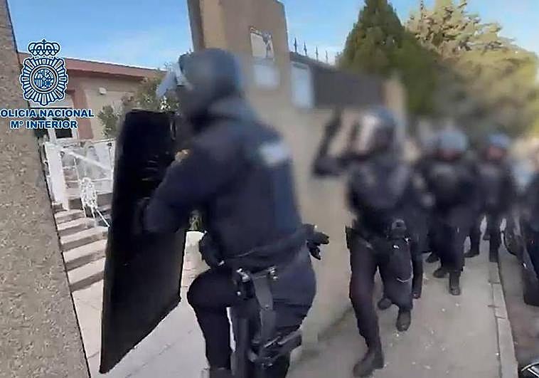 Police spring into action duing the drugs raid.