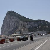 Gibraltar runway is currently crossed by traffic and pedestrians.