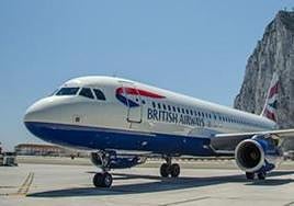 A BA aircraft with a backdrop of the Rock.