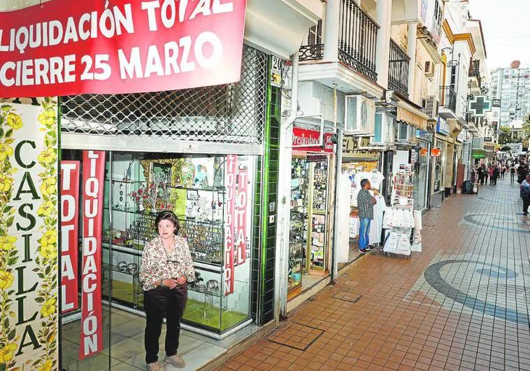 Pepa Montes stands in the doorway of her shop on Calle San Miguel in the centre of Torremolinos.
