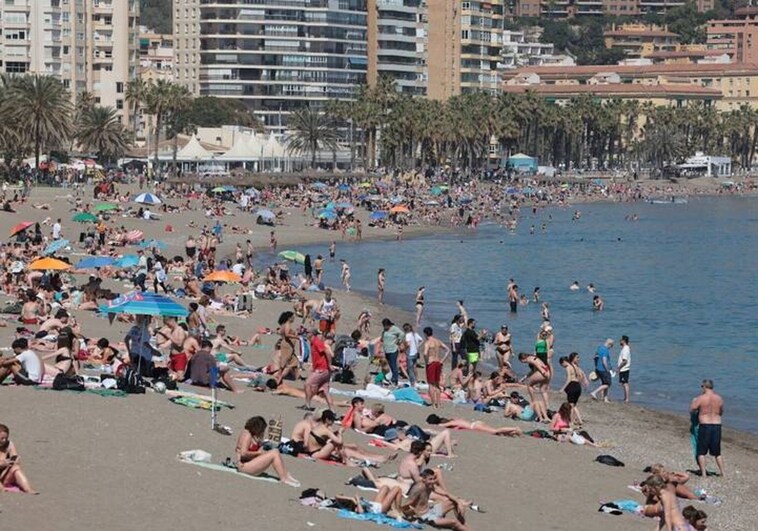 Easter week on a packed Malaga city beach.