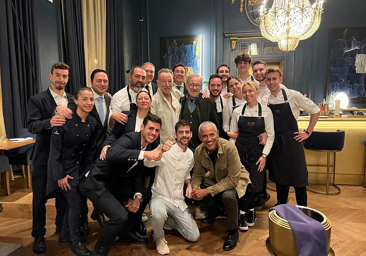Staff from Amar restaurant with Obama, Spielberg and Springsteen.