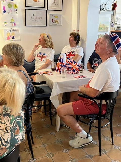 members watch the coronation