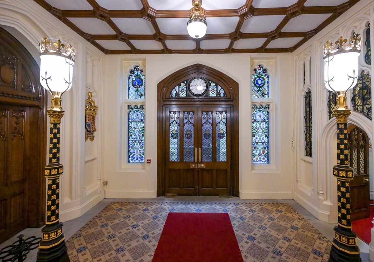 The new stained glass windows depicting all 16 Overseas Territories coats of arms.