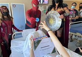 Superheroes visited hospitalised children.