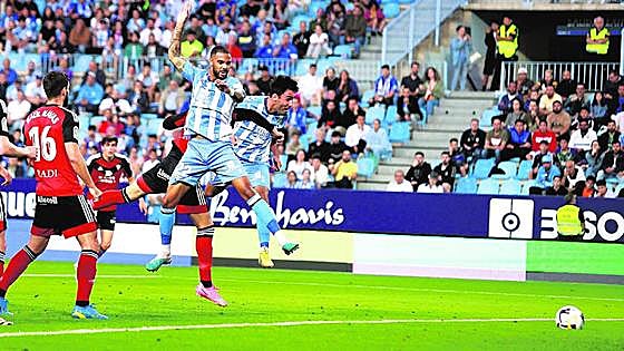 Malaga keep faint chance of a miracle alive