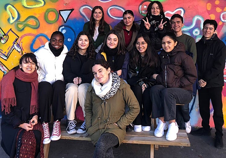 María Gómez, with pupils and classmates from Lycee Paul Langevin high school in Suresnes, a town near Paris.