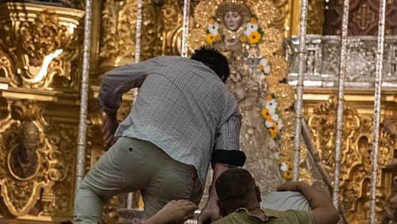 Locals pile into statue of Our Lady