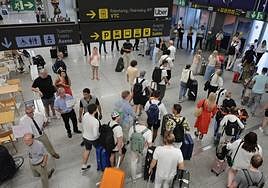 Tourists in the arrivals area of Malaga Airport.