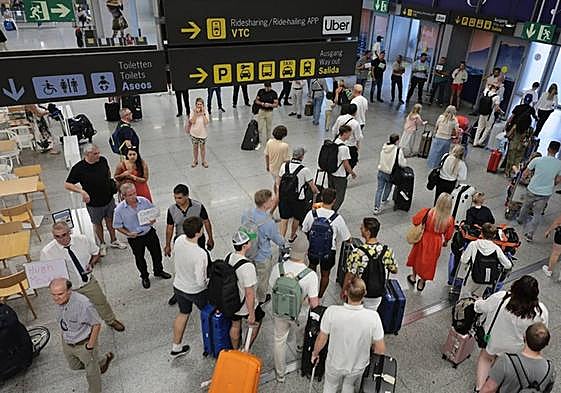 Tourists in the arrivals area of Malaga Airport.