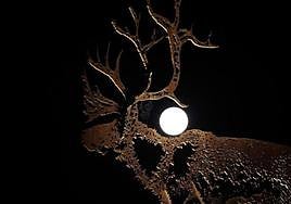 View of the July supermoon, also called the Buck Moon, from the Portuguese town of Vila Nova de Cerveira.