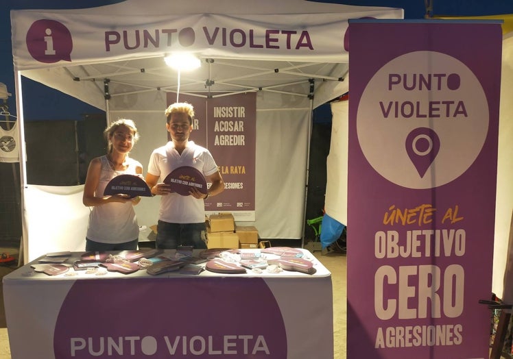Angela and Jairo at the 'purple point' stall