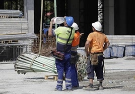 Construction workers in Malaga city this summer.