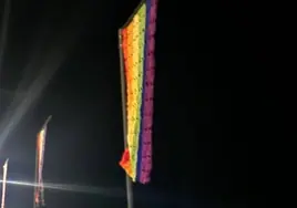 Image of the crocheted rainbow flags outside Almáchar town hall.