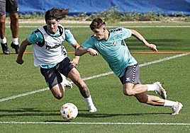 Álex Calvo and Cristian during preseason training.