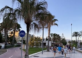 The cake is being served on Torre del Mar's promenade, near the lighthouse