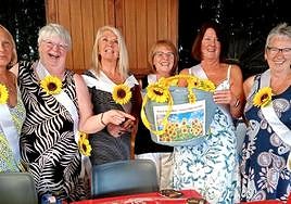 A group of foreign-resident volunteers at a fundraising event in spring this year.
