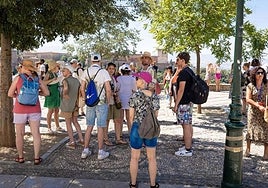 A group of tourists in Granada's Albaicín.