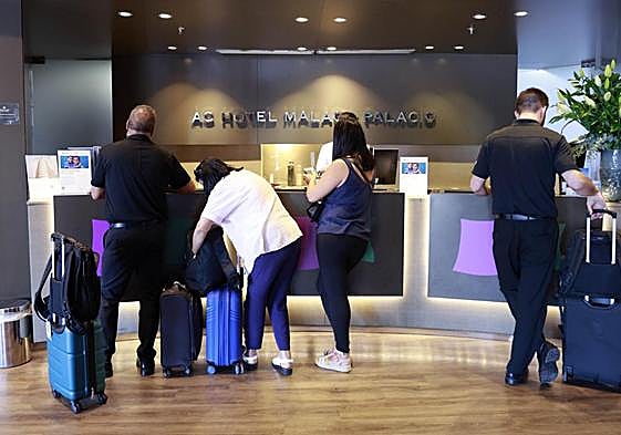 Guests checking in at a Malaga hotel earlier this month.
