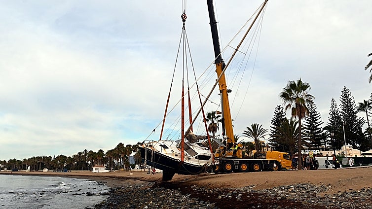 Huge crane finally removes the sailboat stranded on San Pedro beach after almost two-month delay
