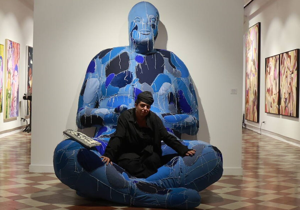 Ela Fidalgo, sitting on the iconic 'Gordita' that opens the exhibition.