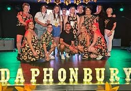 Tony Whitehouse (c) with some of the local expat community who helped run the fundraising event.