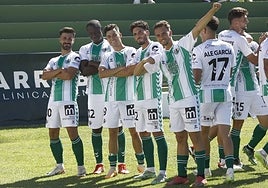 The Antequera players celebrate in front of their fans.