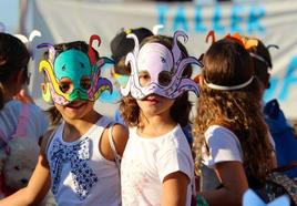 Children during a mask-making workshop at a previous festival.