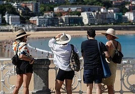 Tourists on La Concha beach in San Sebastian.